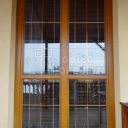 Balkonové dřevěné dveře po opravě pomocí systému hliníkového opláštění (barva RAL)