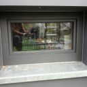Okno po opravě systémem hliníkového opláštění (barva metalický antracit)